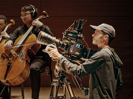 Down Below director of photography Travis LaBella operates a camera while Northwestern student musicians perform original works.