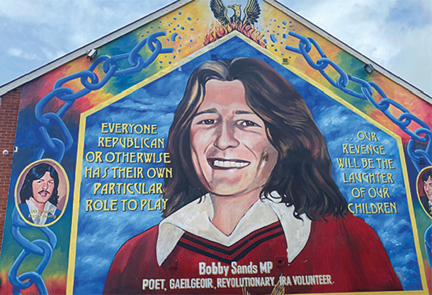 A large mural on a building showing a woman 