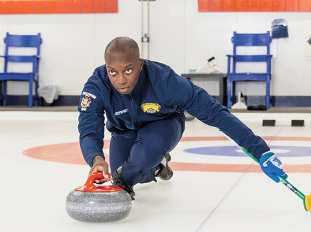 Portrait of Jeffery Coleman curling