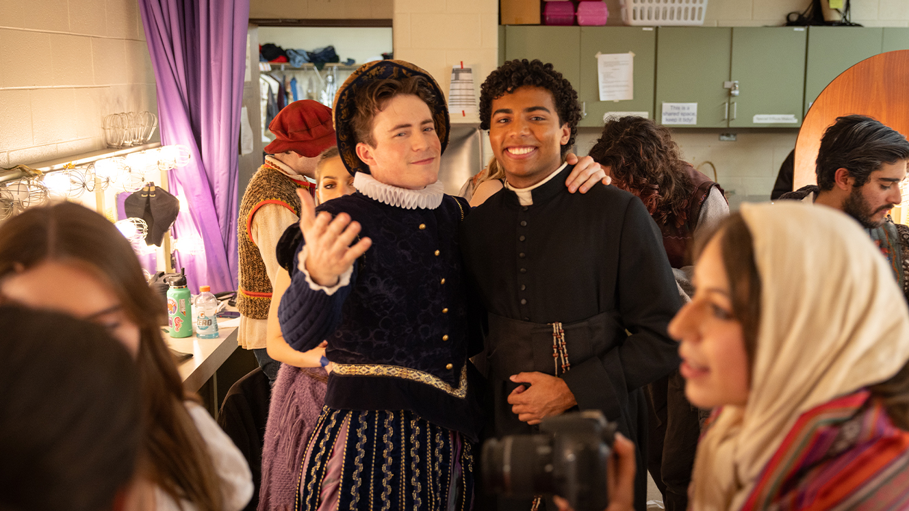 Theo Gyra and Mackenzie Kirkwood pose in costume for a picture in one of the dressing rooms backstage. 