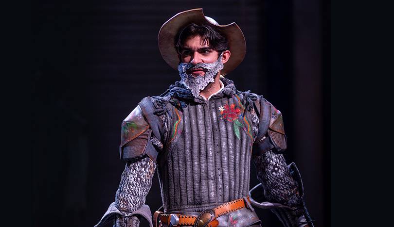 Esteban Ortiz-Villacorta stands on stage, dressed as Don Quixote.