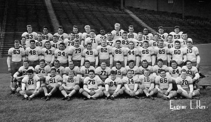 In this black-and-white image, the Northwestern Wildcats football team poses for a photo.