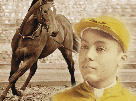 A jockey in a yellow hat and uniform looks into the distance while a brown horse trots in the background.