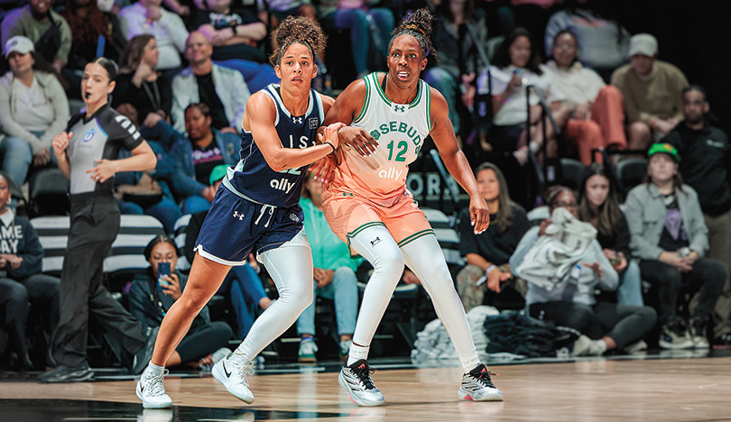 Veronica Burton bumps Chelsea Gray, with a hand on her wrist to defend.