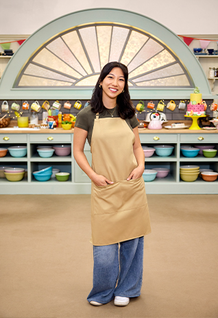 Ruiqi Chen smiles in an apron